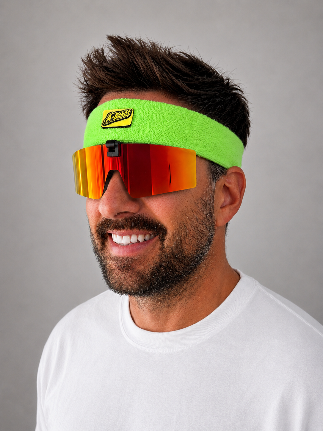 Green headband with red lenses, side view