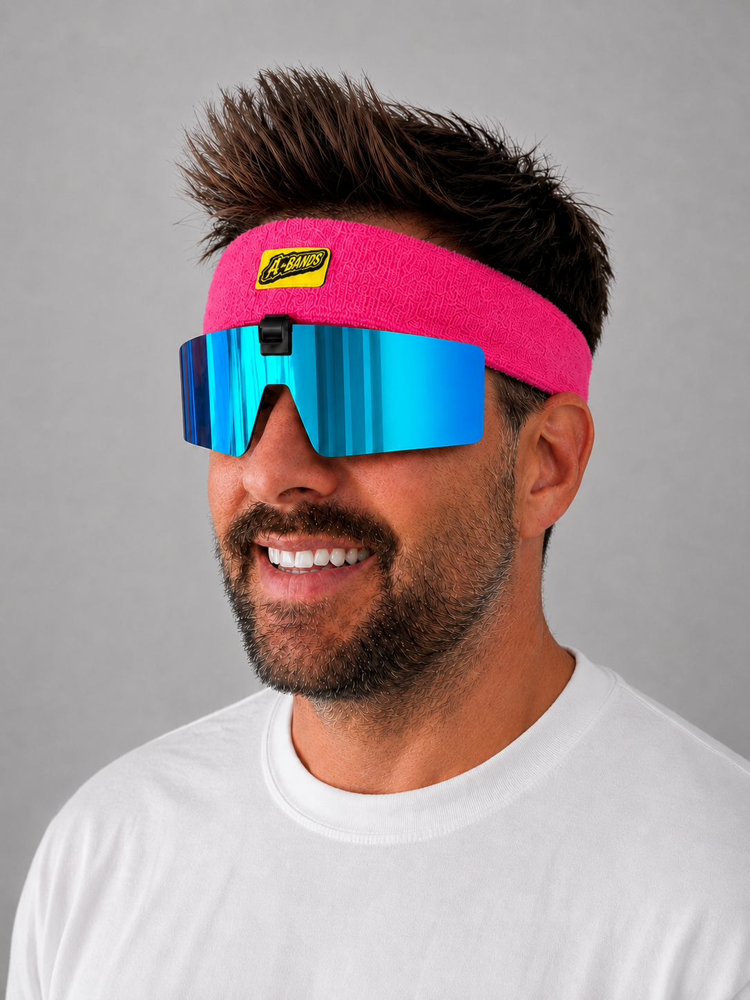 Side profile of A-BANDS pink headband with blue mirrored flip-up lenses